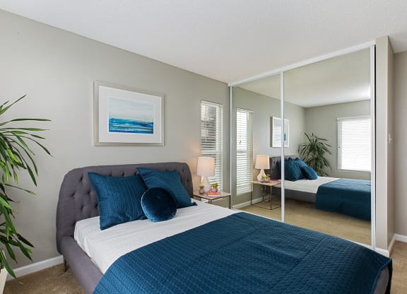 Furnished bedroom interior at OceanAire Apartment Homes, Pacifica