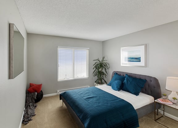 Furnished bedroom interior at OceanAire Apartment Homes, California