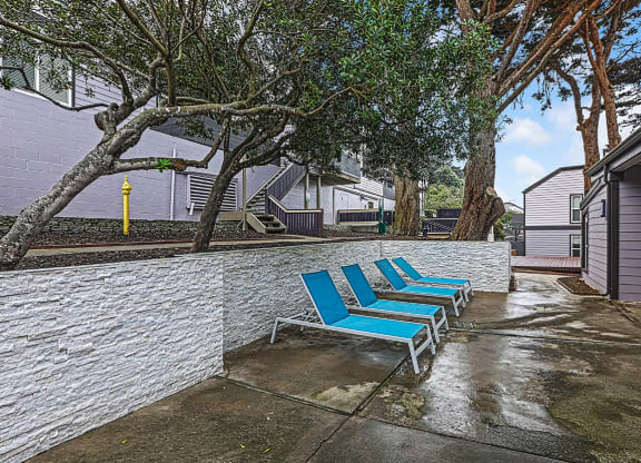 Exterior shot with lounge chairs  at OceanAire Apartment Homes, Pacifica, CA, 94044