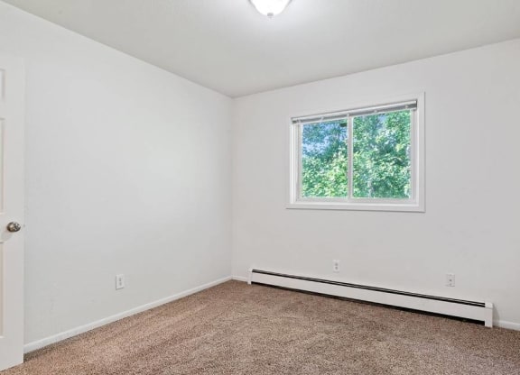 Bedroom with window at ReNew Eagle River, Eagle River