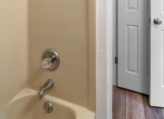 a bathroom with a shower and a door at ReNew End Street, Eagle River, AK, 99577
