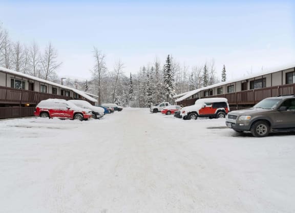 a snow covered parking lot with a blue sky in the background  at ReNew End Street, Alaska