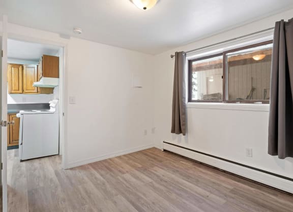 a bedroom with hardwood floors and white walls  at ReNew End Street, Eagle River, AK, 99577
