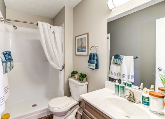 our apartments offer a bathroom with a bathtub  at ReNew at Neill Lake, Eden Prairie, MN