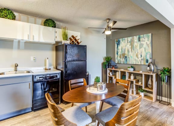 a kitchen and dining area in a 555 waverly unit  at ReNew at Neill Lake, Eden Prairie, MN