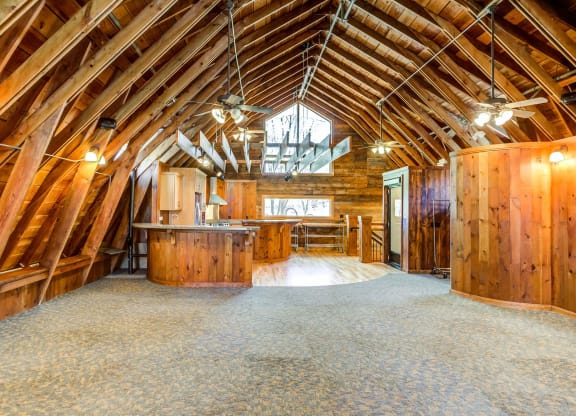 an open floor plan with a kitchen and dining area in a timber frame barn  at ReNew at Neill Lake, Minnesota, 55344