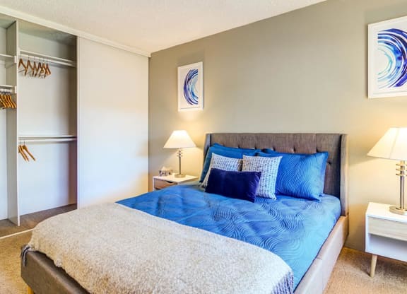 a bedroom with a bed and two night stands at The Bluffs at Mountain Park, Lake Oswego