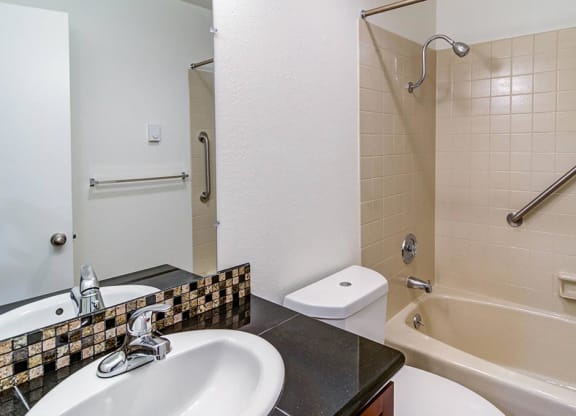 a bathroom with a sink toilet and bathtub at The Bluffs at Mountain Park, Lake Oswego, OR