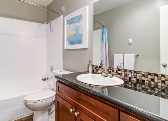 a bathroom with a sink toilet and bathtub at The Bluffs at Mountain Park, Oregon, 97035