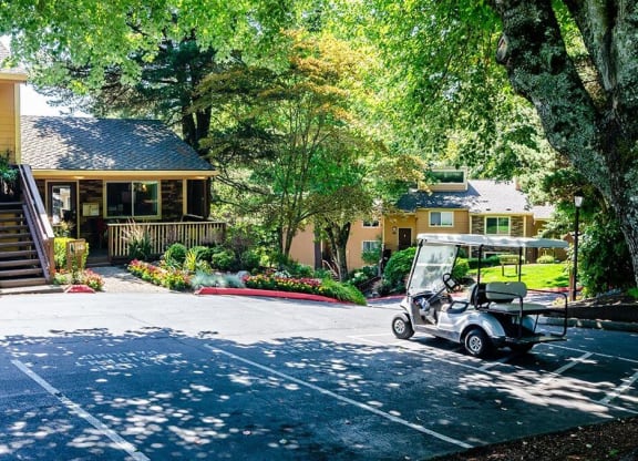 a golf cart parked in front of a house  at The Bluffs at Mountain Park, Lake Oswego, OR