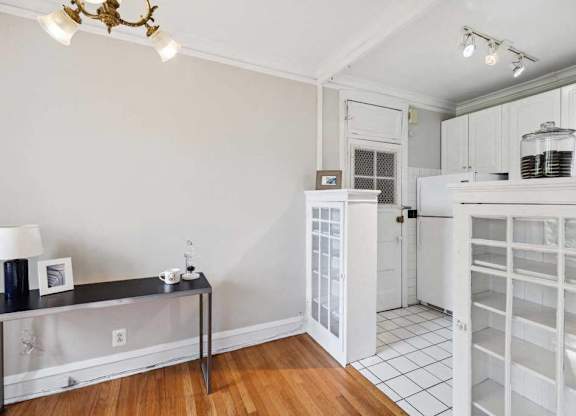 a kitchen with a white refrigerator and a door way at The Bryant at Oak Park I & II, Illinois, 60302