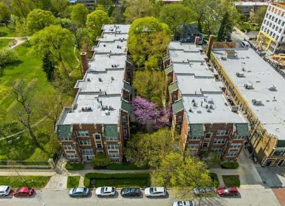 an aerial view of a building next to a parking lot at The Bryant at Oak Park I & II, Oak Park, IL