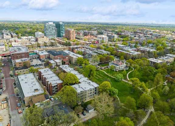 an aerial view of a city with buildings and trees at The Bryant at Oak Park I & II, Illinois