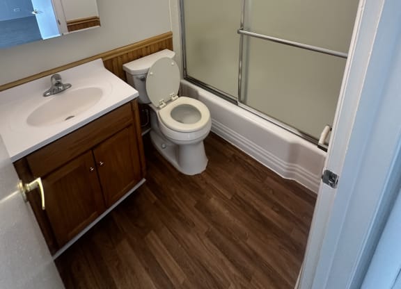 a bathroom with a toilet and a shower at River Oaks, North Aurora, Illinois