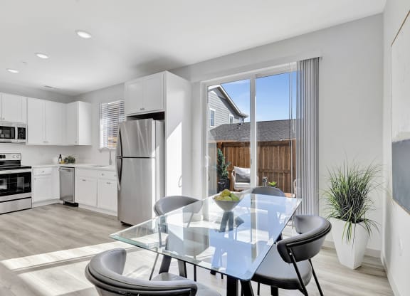 Kitchen and dining room with a glass table