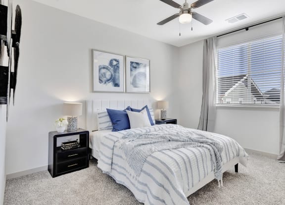 Bedroom with a bed and a ceiling fan
