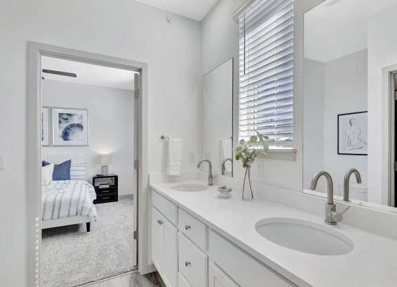 Bathroom with two sinks and a mirror