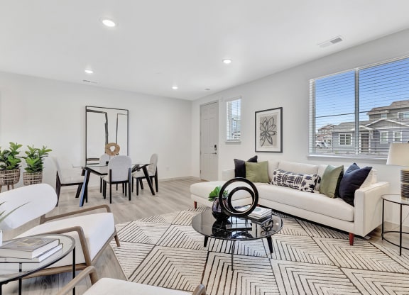 Living room with a couch and a dining room table