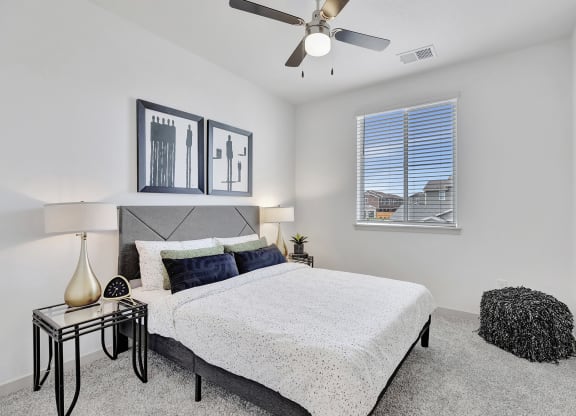 Bedroom with a bed and a ceiling fan