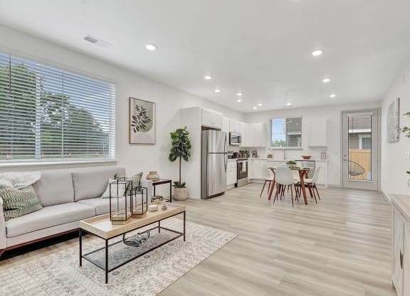 Living room with a dining room and a kitchen