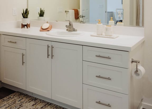 a bathroom with white cabinets and a large mirror  at Arrive Paso Robles, Paso Robles, 93446