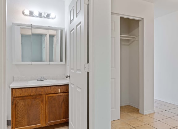 a bathroom with a sink and a mirror at ReNew Eagle River, Alaska