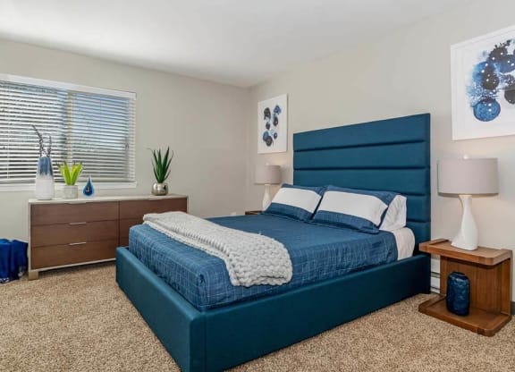 Bedroom with a bed and a dresser at Renew Madison, Madison