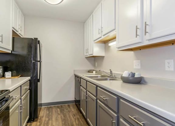 Kitchen with a stove top oven next to a refrigerator  at Renew Madison, Madison, 53711