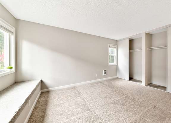 Bedroom with a carpeted floor and a window at River Lofts Apartments, Oregon, 97062