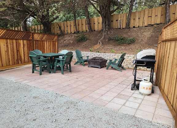 A patio with a table and chairs and a gas grill at Salinas Sunset Apartments, Salinas, California