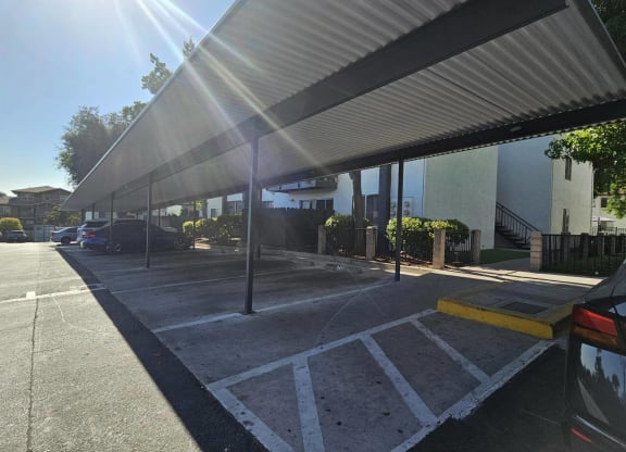 a car parked under awning in a parking lotat Alturas Paso Robles Apartment Homes, Paso Robles, CA, 93446