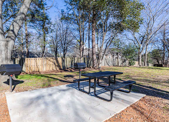 two picnic tables and two barbecue pits in a park at Sharon West, Charlotte, 28210