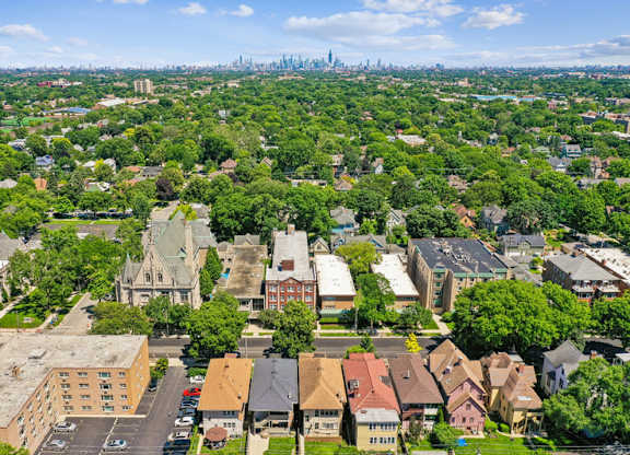 A bird's eye view of a residential area with houses and trees.