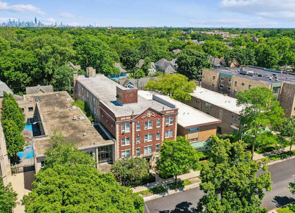 A bird's eye view of a city with buildings and trees.