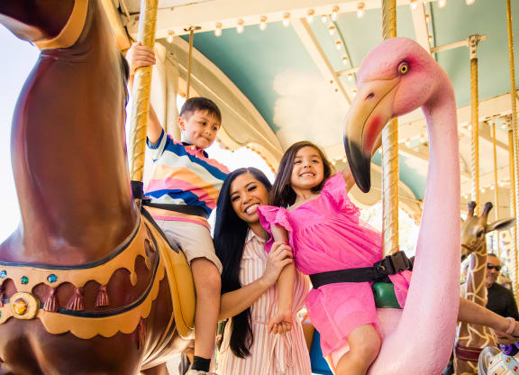 family on carousel at Arrive Vacaville, Vacaville, CA, 95687