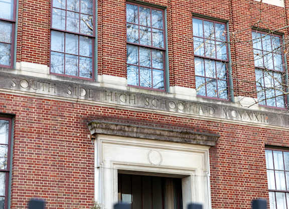 a brick building with the words south side high school in front of it
