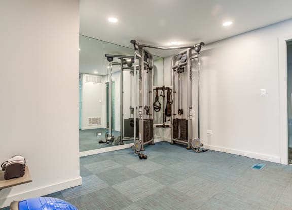 a home gym with a treadmill and exercise equipment at The Township at St. Charles, St. Charles