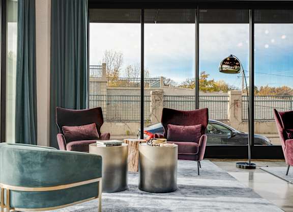 A modern room with a view of the outside through large windows. at The Shale, Minnesota