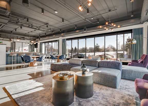 A modern room with a large window at The Shale, Minneapolis, MN 55406