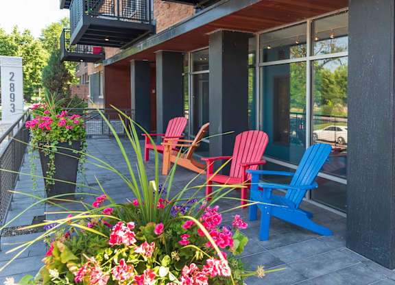 Patio with Red and Blue Chair at The Venue on Knox Apartments, Minneapolis, 55408