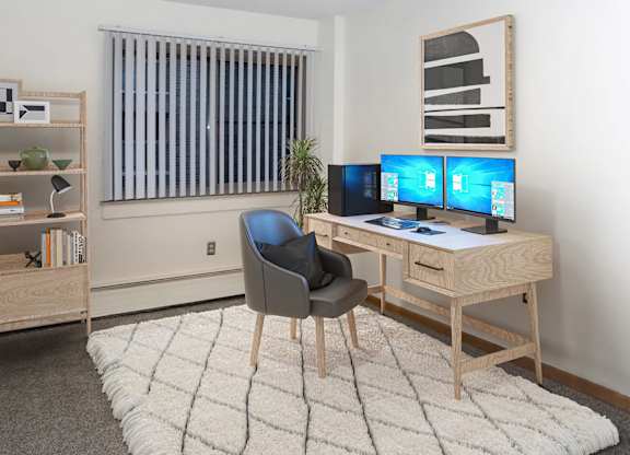 Room with desk and chair at The Venue on Knox Apartments, Minneapolis