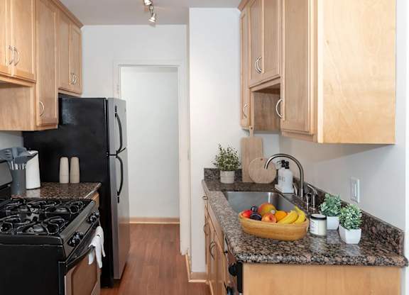 Kitchen with Cabinets at The Venue on Knox Apartments, Minnesota, 55408