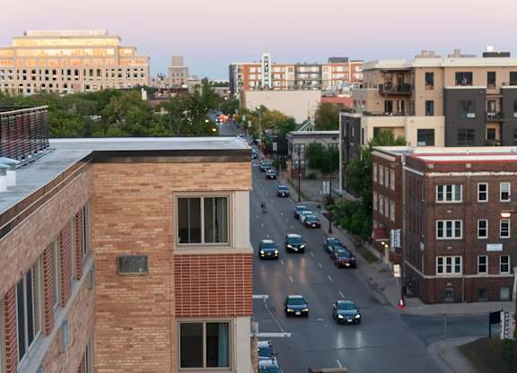View of city street at dusk at The Venue on Knox Apartments, Minneapolis, Minnesota