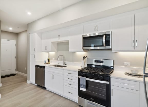kitchen with white cabinets and kitchen appliances at Arrive Temecula