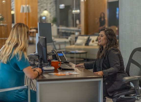 a woman sitting at a desk with a computer in front of her  at West77, Chicago, IL, 60654