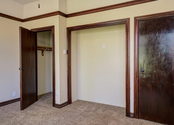 Bedroom with closets and two doors at Whitney Gray, Portland, OR ?