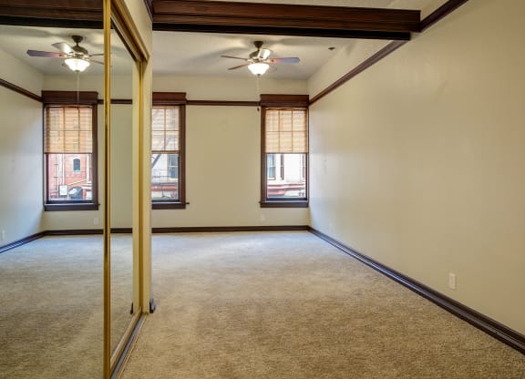 the living room of an empty home with a mirrored door at Whitney Gray, Oregon ?