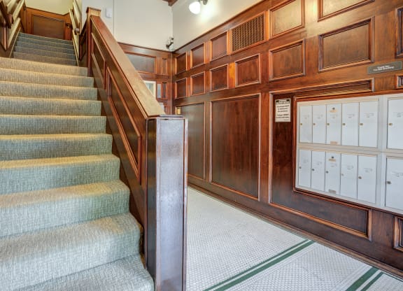 a staircase in a building with wooden walls, mailboxes, and stairs at Whitney Gray, Portland, OR ?