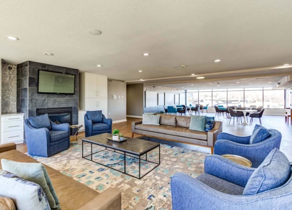 a living room filled with furniture and a large window