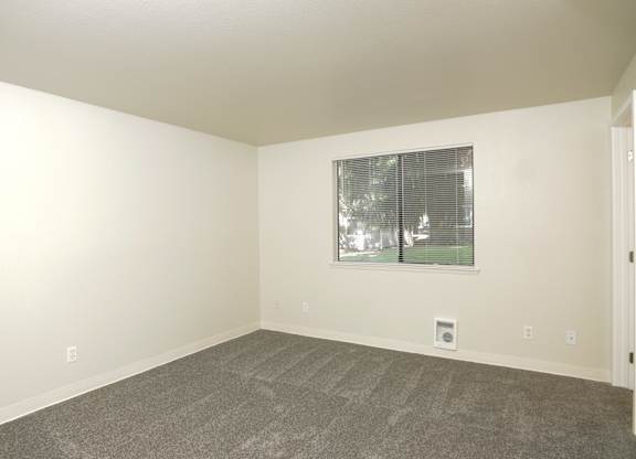 A room with a window and a door.